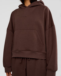 Woman wearing Post Train Hoodie - Hot Chocolate | Model:Ruby | Size:S