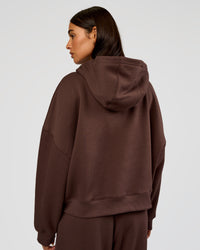 Woman wearing Post Train Hoodie - Hot Chocolate | Model:Ruby | Size:S