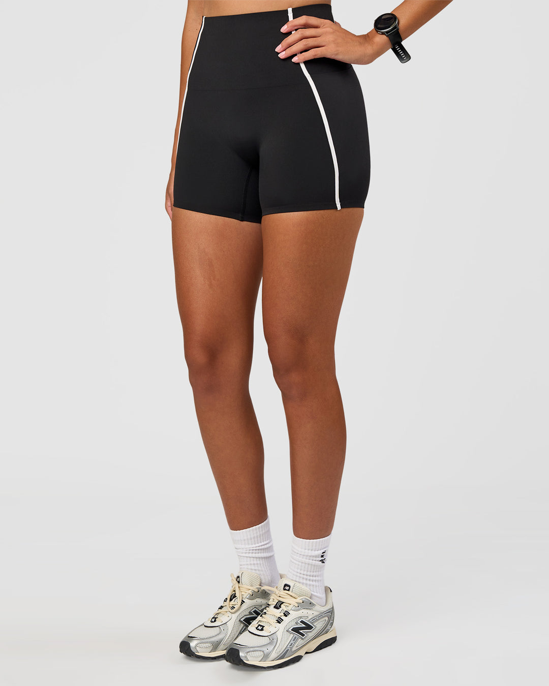 Woman wearing Power Ultra High-Rise 4" Short Pockets - Black | Model:Rhiley | Size:S