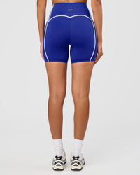 Woman wearing Power Ultra High-Rise 6" Short - Electric Indigo | Model:Rhiley | Size:S