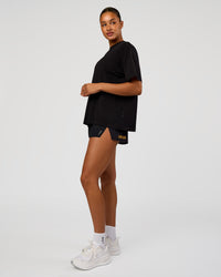 Woman wearing Pride Go-To FLXCotton Oversized Tee - Black | Model:Rosie | Size:S