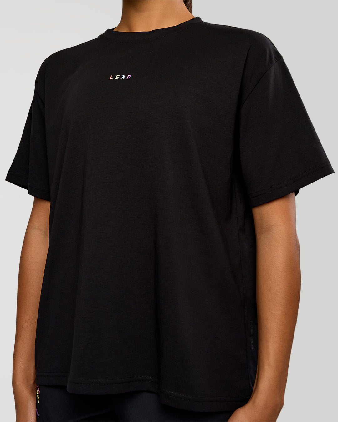 Woman wearing Pride Go-To FLXCotton Oversized Tee - Black | Model:Rosie | Size:S