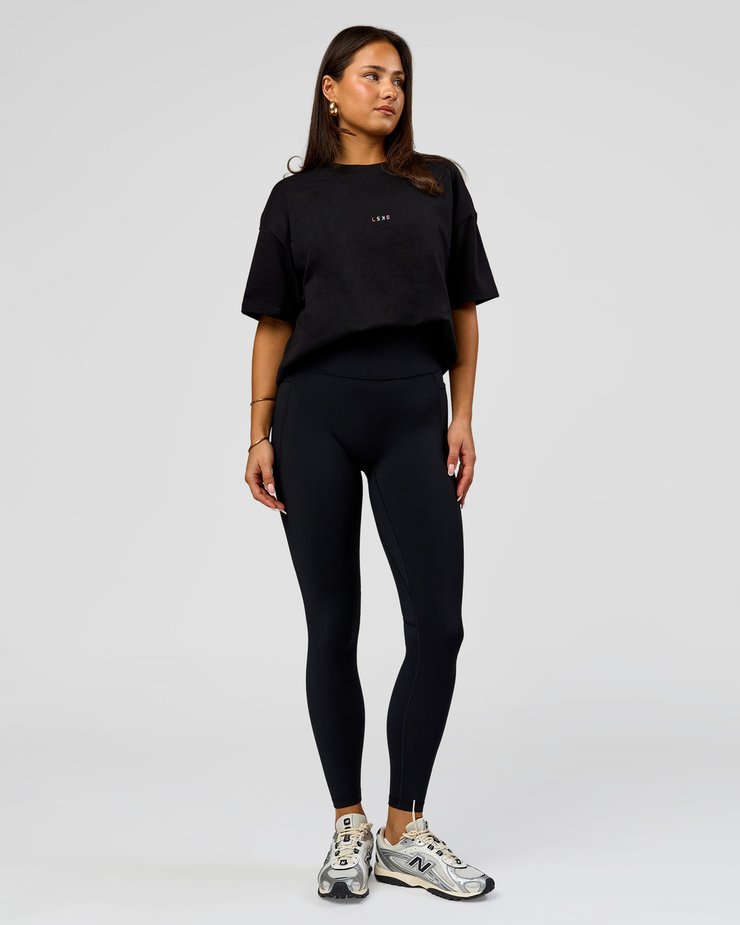 Woman wearing Pride Sticker Boxy Tee - Black | Model:Bianca | Size:S