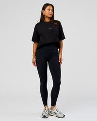 Woman wearing Pride Sticker Boxy Tee - Black | Model:Bianca | Size:S