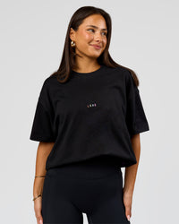 Woman wearing Pride Sticker Boxy Tee - Black | Model:Bianca | Size:S