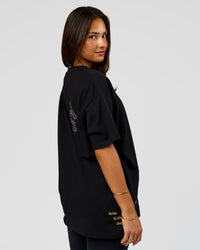 Woman wearing Pride Sticker Boxy Tee - Black | Model:Bianca | Size:S