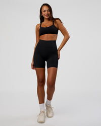 Woman wearing Progression Ultra High-Rise 6" Short - Black | Model:Kirstyn | Size:S