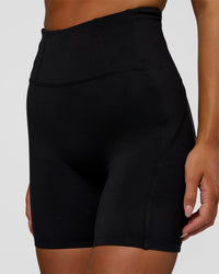 Woman wearing Progression Ultra High-Rise 6" Short - Black | Model:Kirstyn | Size:S