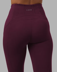 Woman wearing Progression Ultra High-Rise Full Length Legging - Cherry Lacquer| Model:Rhiley | Size:S