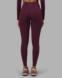 Woman wearing Progression Ultra High-Rise Full Length Legging - Cherry Lacquer| Model:Rhiley | Size:S