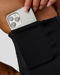 Woman wearing Progression Ultra High-Rise 4" Short - Black | Model:Kirstyn | Size:S