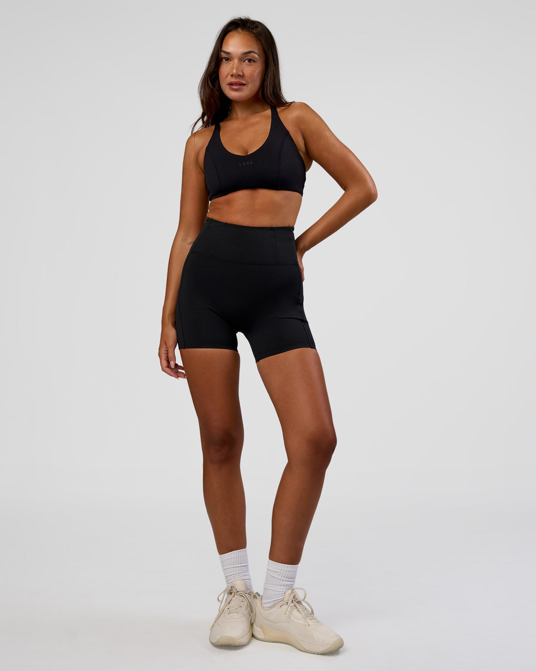 Woman wearing Progression Ultra High-Rise 4" Short - Black | Model:Kirstyn | Size:S