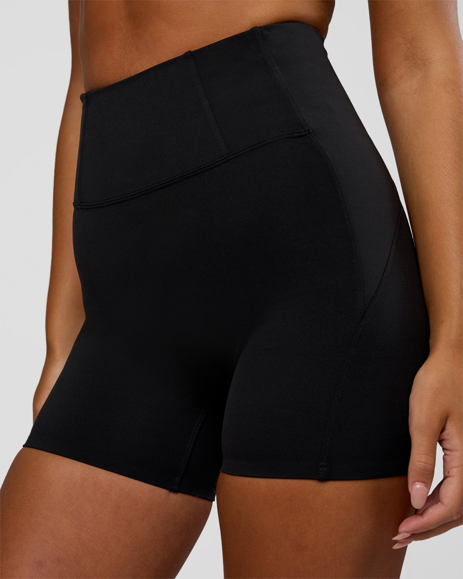 Woman wearing Progression Ultra High-Rise 4" Short - Black | Model:Kirstyn | Size:S