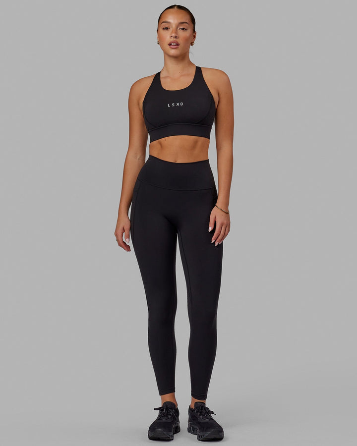 Woman wearing Propel Sports Bra - Black