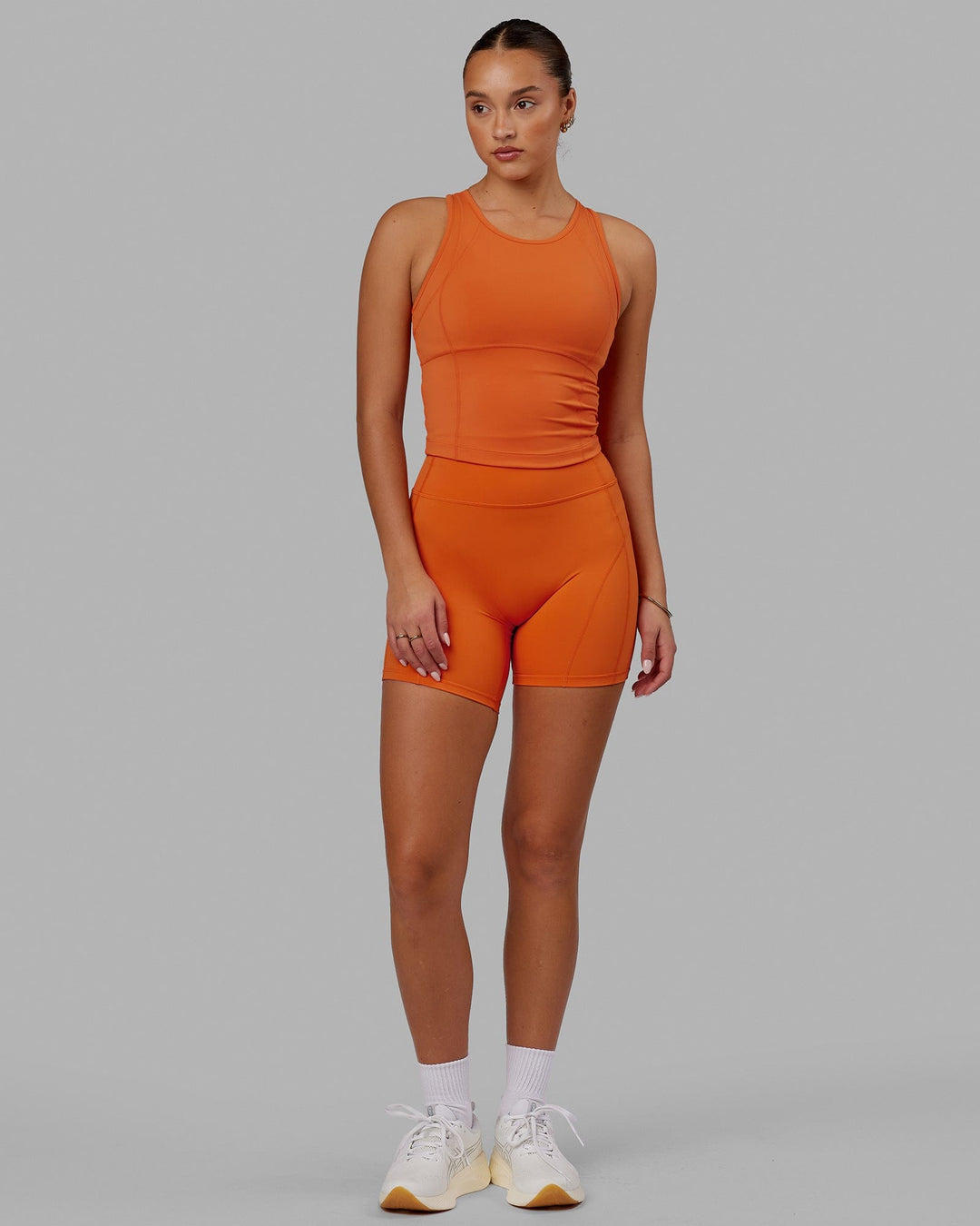 Woman wearing Propel Performance Tank - Burnt Orange