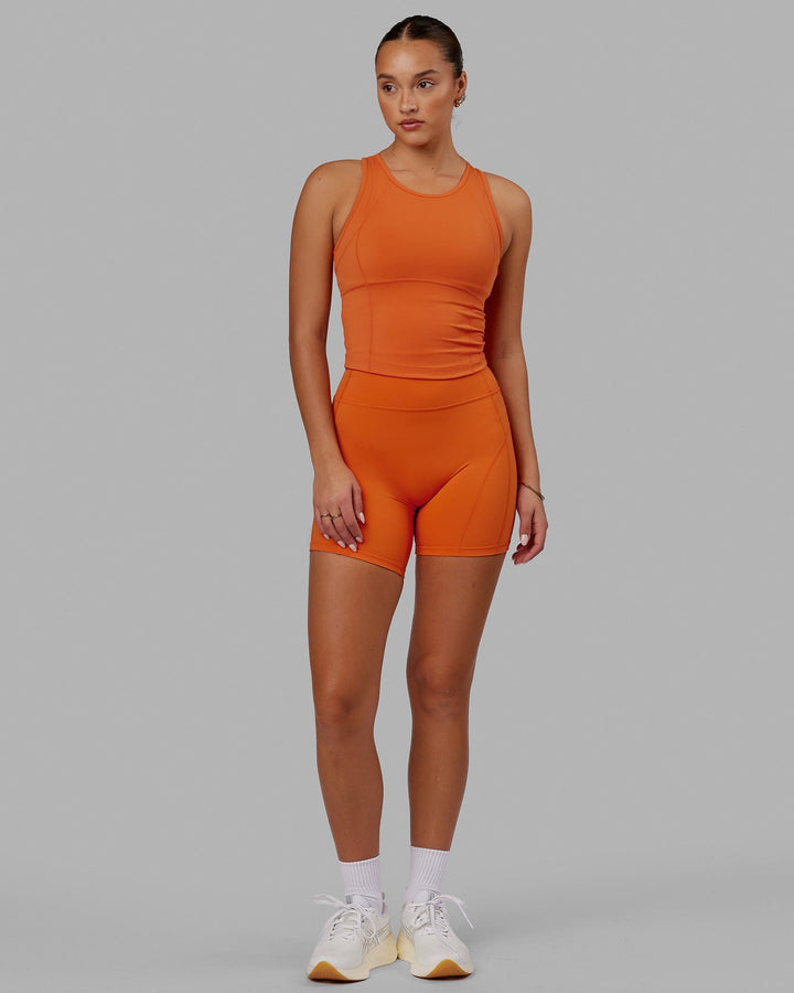 Woman wearing Propel Performance Tank - Burnt Orange