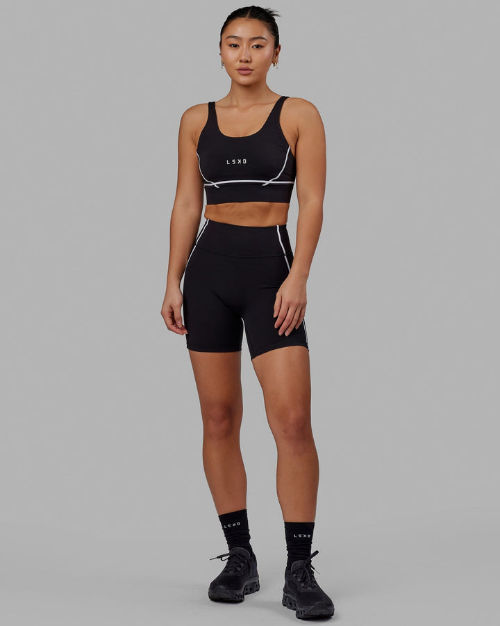 Woman wearing Pulse Mid Short Tight - Black
