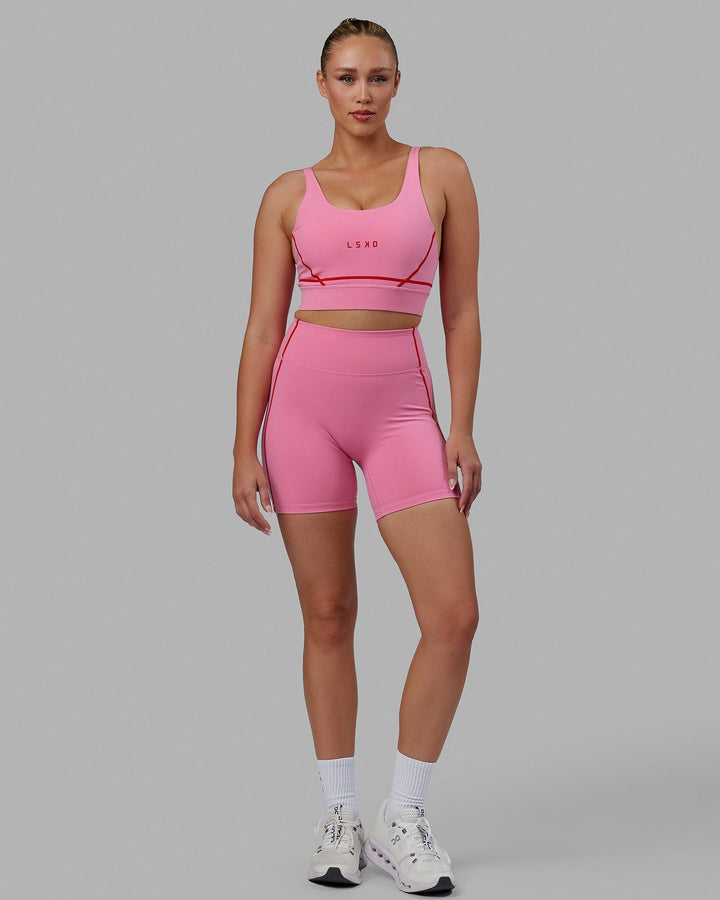 Woman wearing Pulse Mid Short Tights - Pink Rose-Scarlet