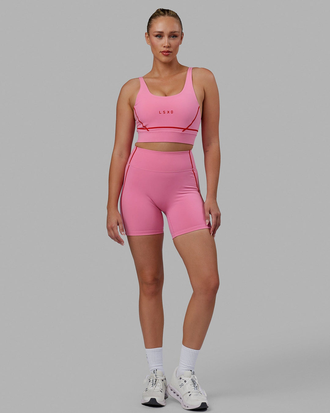 Woman wearing Pulse Sports Bra - Pink Rose-Scarlet