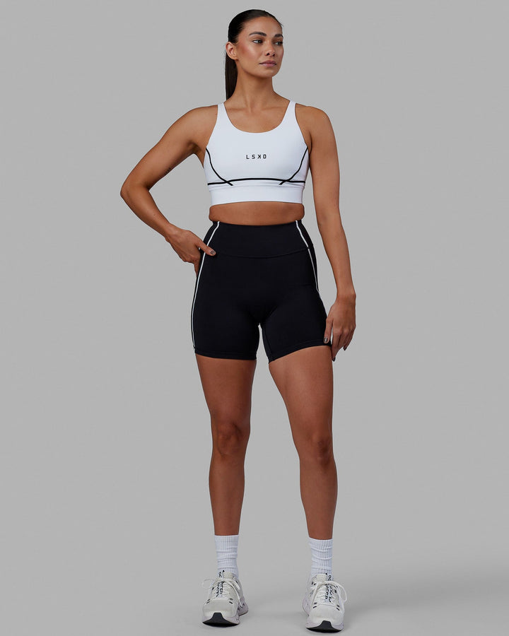 Woman wearing Pulse Sports Bra - White