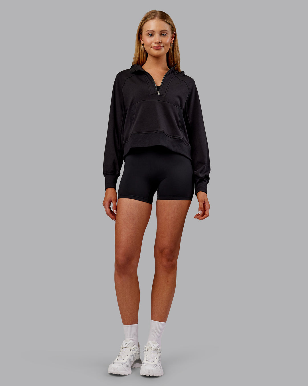 Woman wearing Pursue Mid-Weight Hoodie - Black | Model:Ella | Size:S