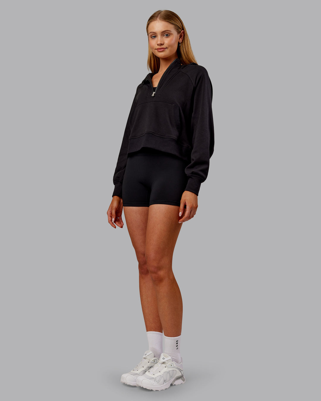 Woman wearing Pursue Mid-Weight Hoodie - Black | Model:Ella | Size:S