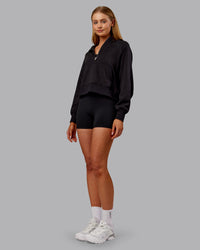 Woman wearing Pursue Mid-Weight Hoodie - Black | Model:Ella | Size:S