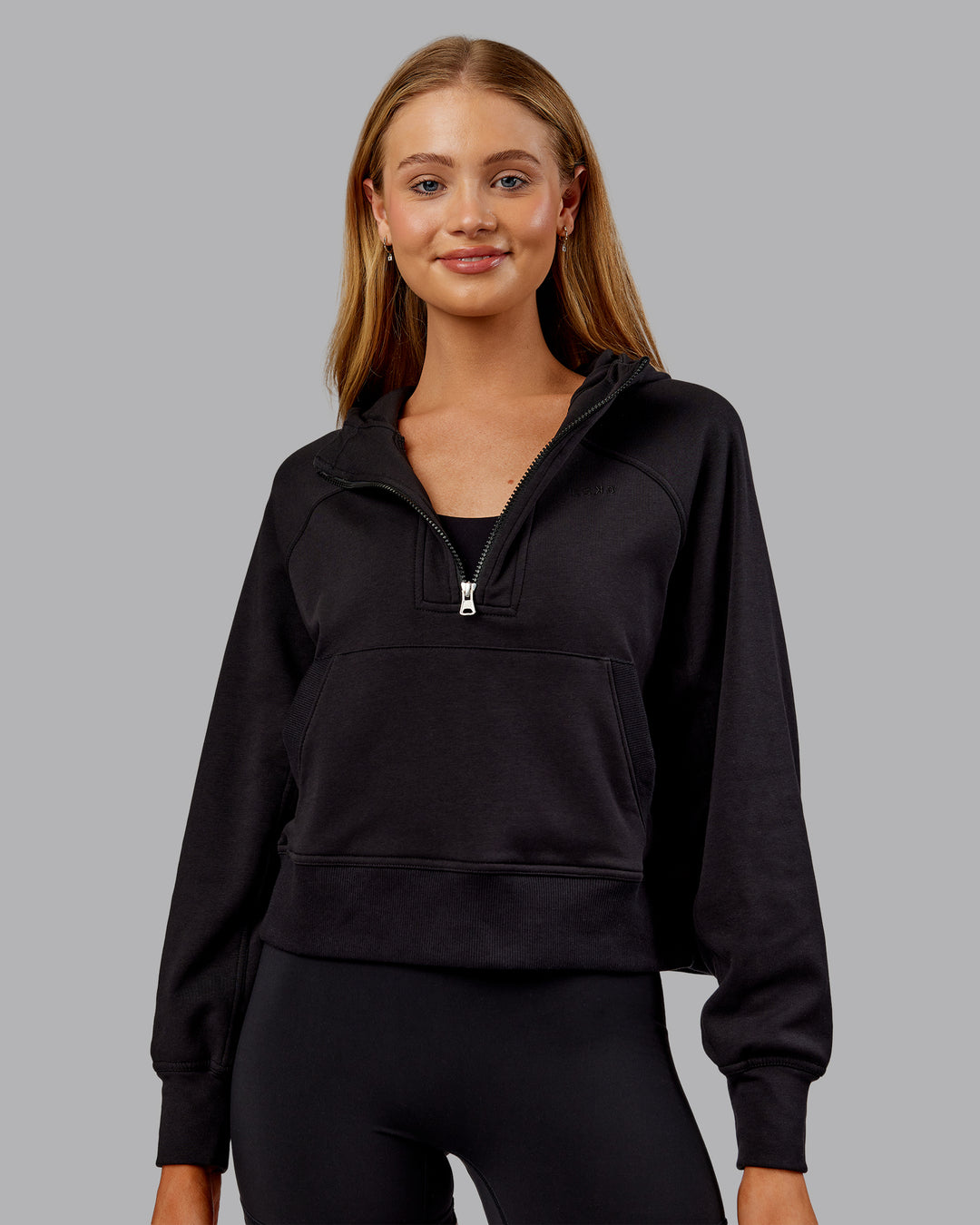 Woman wearing Pursue Mid-Weight Hoodie - Black | Model:Ella | Size:S