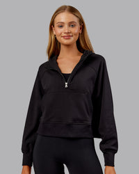 Woman wearing Pursue Mid-Weight Hoodie - Black | Model:Ella | Size:S