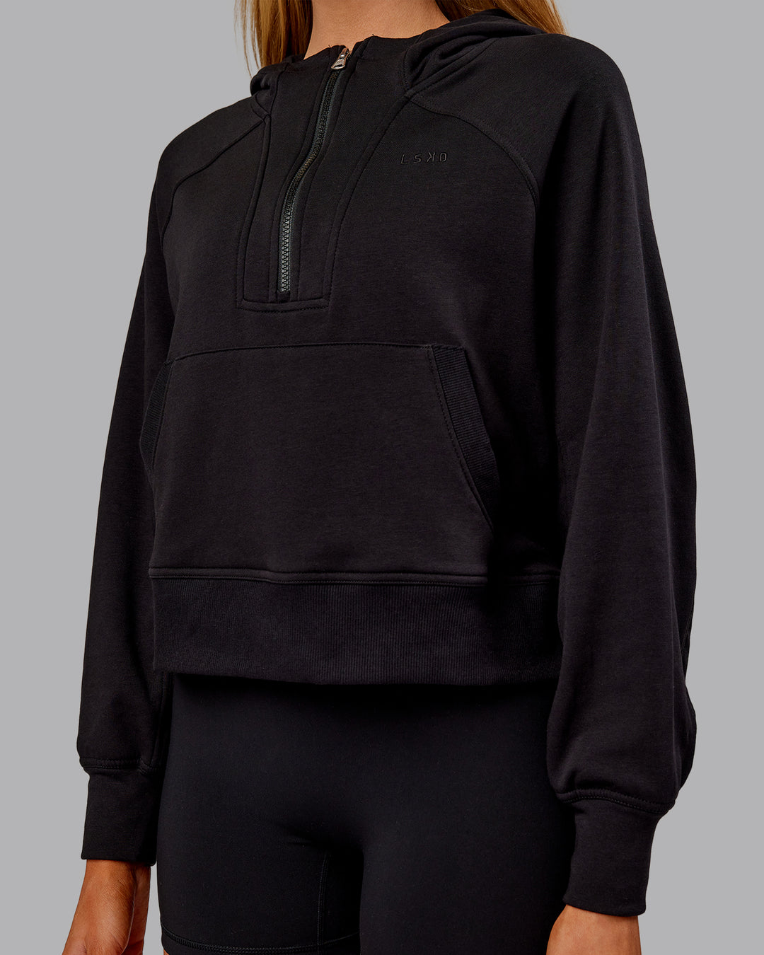Woman wearing Pursue Mid-Weight Hoodie - Black | Model:Ella | Size:S