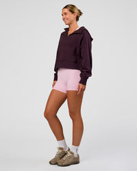Woman wearing Pursue Mid-Weight Hoodie - Midnight Plum | Model:Amity | Size:S