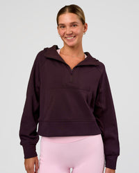 Woman wearing Pursue Mid-Weight Hoodie - Midnight Plum | Model:Amity | Size:S