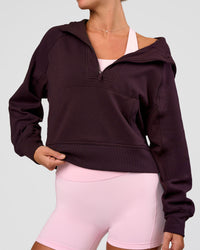 Woman wearing Pursue Mid-Weight Hoodie - Midnight Plum | Model:Amity | Size:S