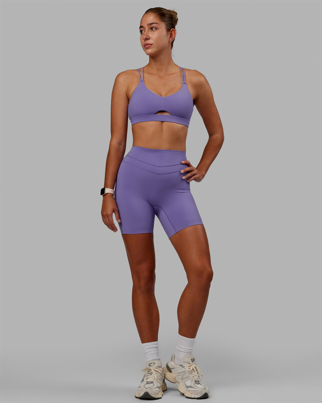 Woman wearing Pursue Sports Bra - Dahlia Purple