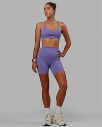 Woman wearing Pursue Sports Bra - Dahlia Purple