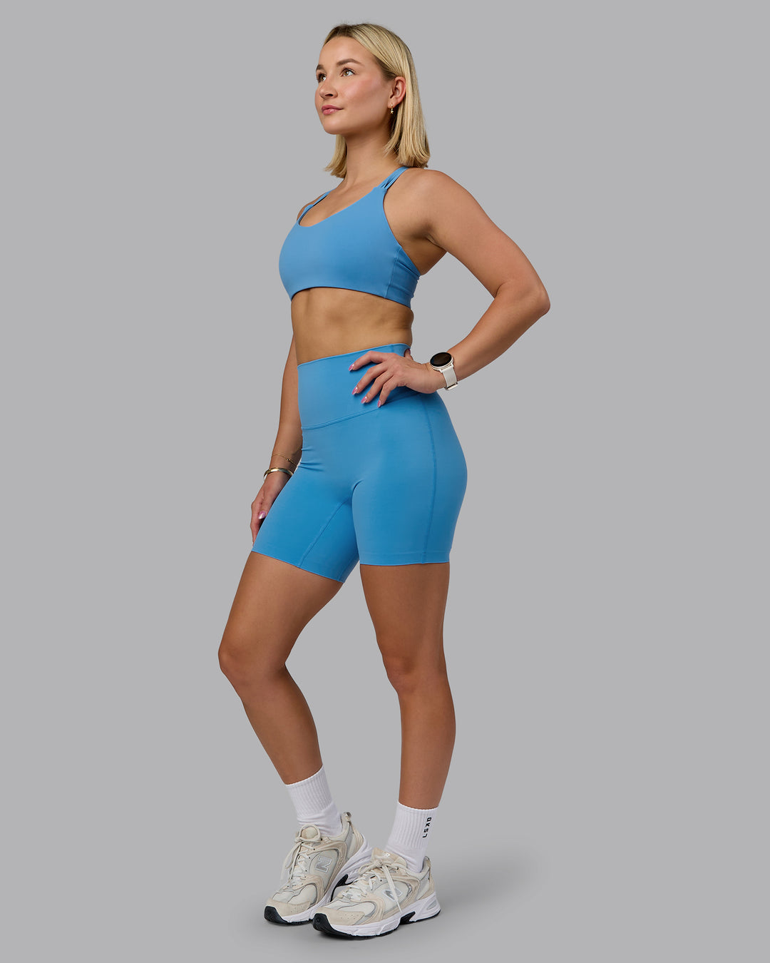 Woman wearing Push The Limit Sports Bra - Azure Blue | Model:Halle | Size:S