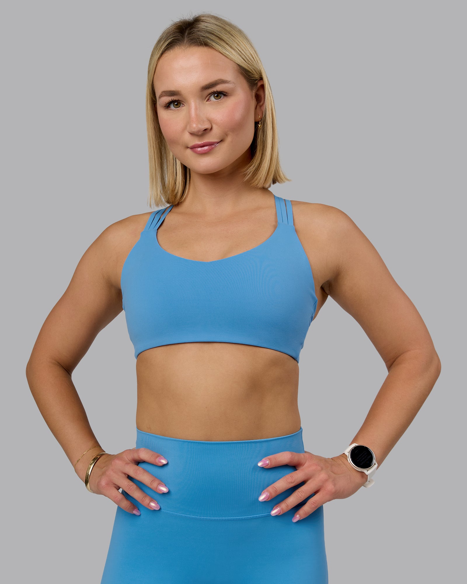 Woman wearing Push The Limit Sports Bra - Azure Blue | Model:Halle | Size:S