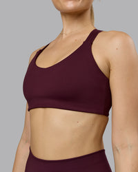 Woman wearing Push The Limit Sports Bra - Cherry Lacquer  Model:Emilie | Size:S
