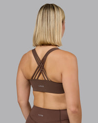 Woman wearing Push The Limit Sports Bra in Chocolate Martini | Model:Halle | Size:S