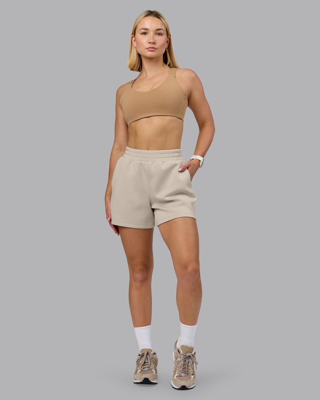Woman wearing Push The Limit Sports Bra - Light Taupe | Model:Halle | Size:S