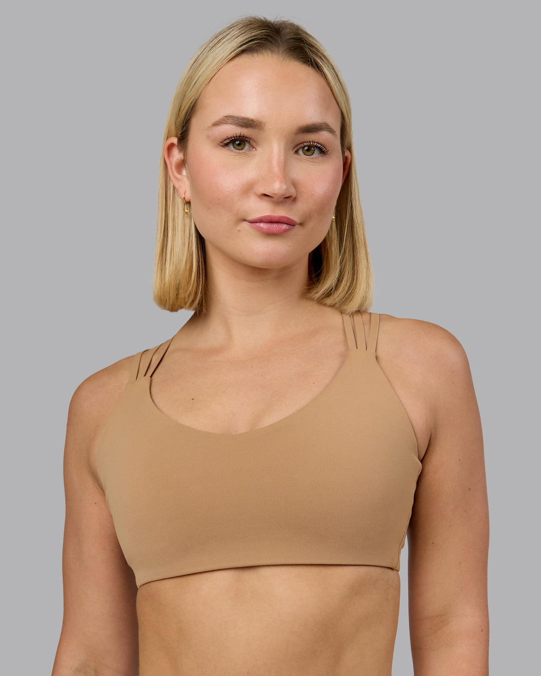 Woman wearing Push The Limit Sports Bra - Light Taupe | Model:Halle | Size:S
