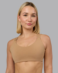 Woman wearing Push The Limit Sports Bra - Light Taupe | Model:Halle | Size:S