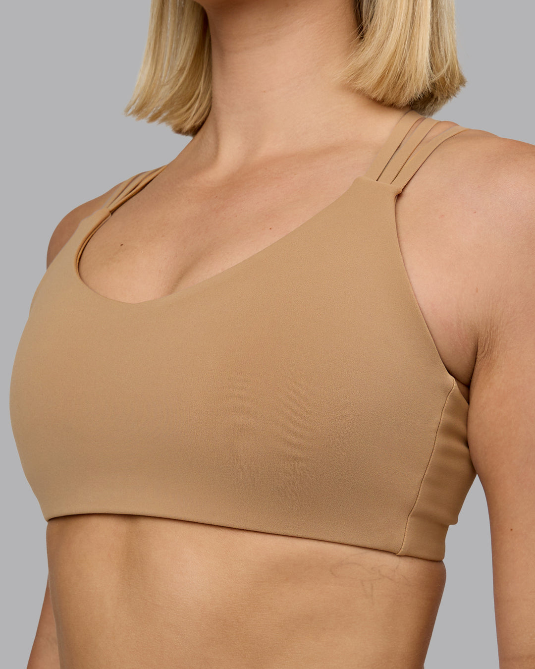 Woman wearing Push The Limit Sports Bra - Light Taupe | Model:Halle | Size:S