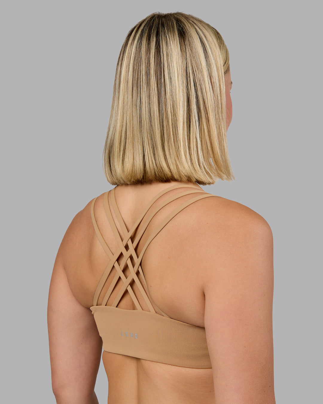Woman wearing Push The Limit Sports Bra - Light Taupe | Model:Halle | Size:S