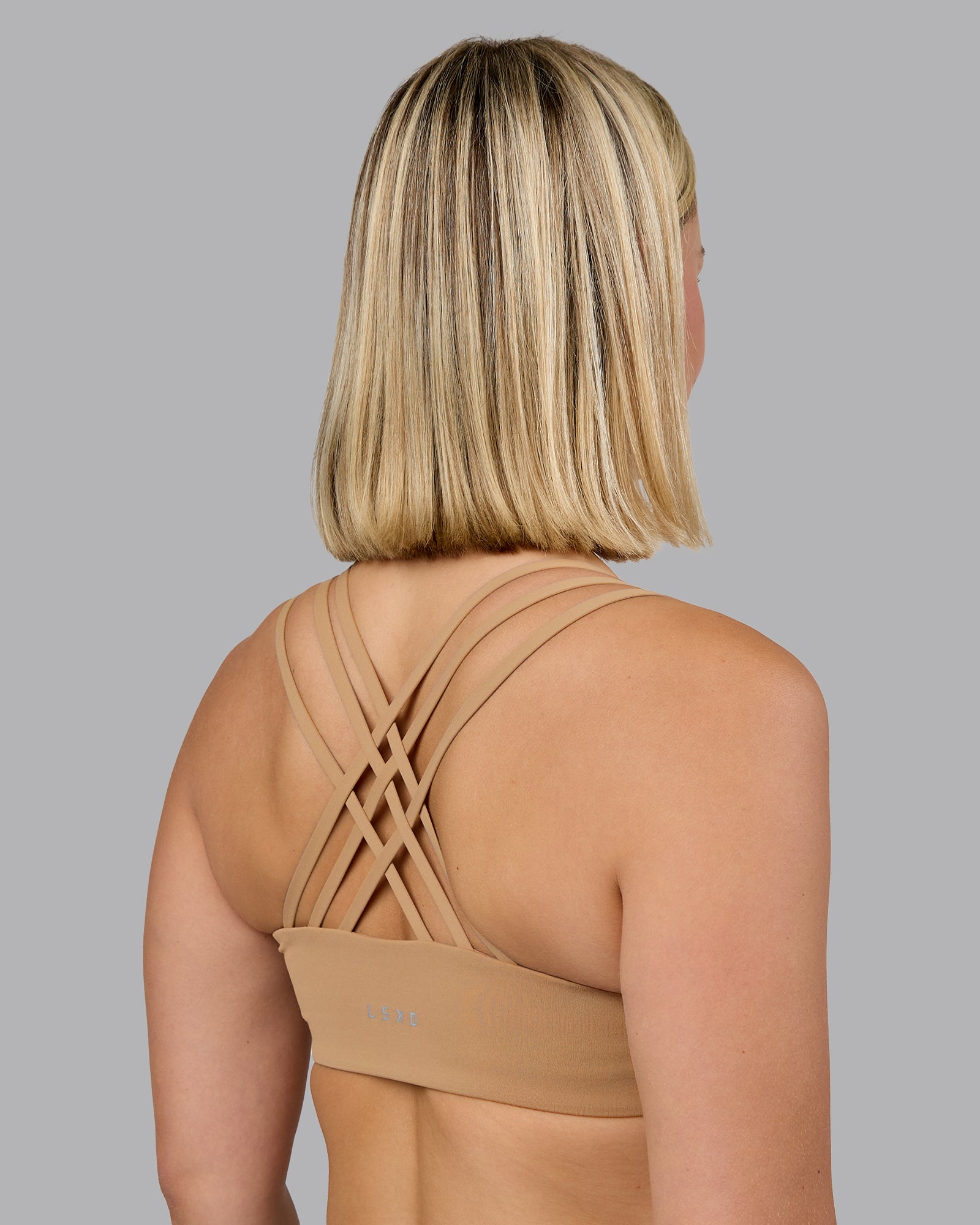 Woman wearing Push The Limit Sports Bra - Light Taupe | Model:Halle | Size:S