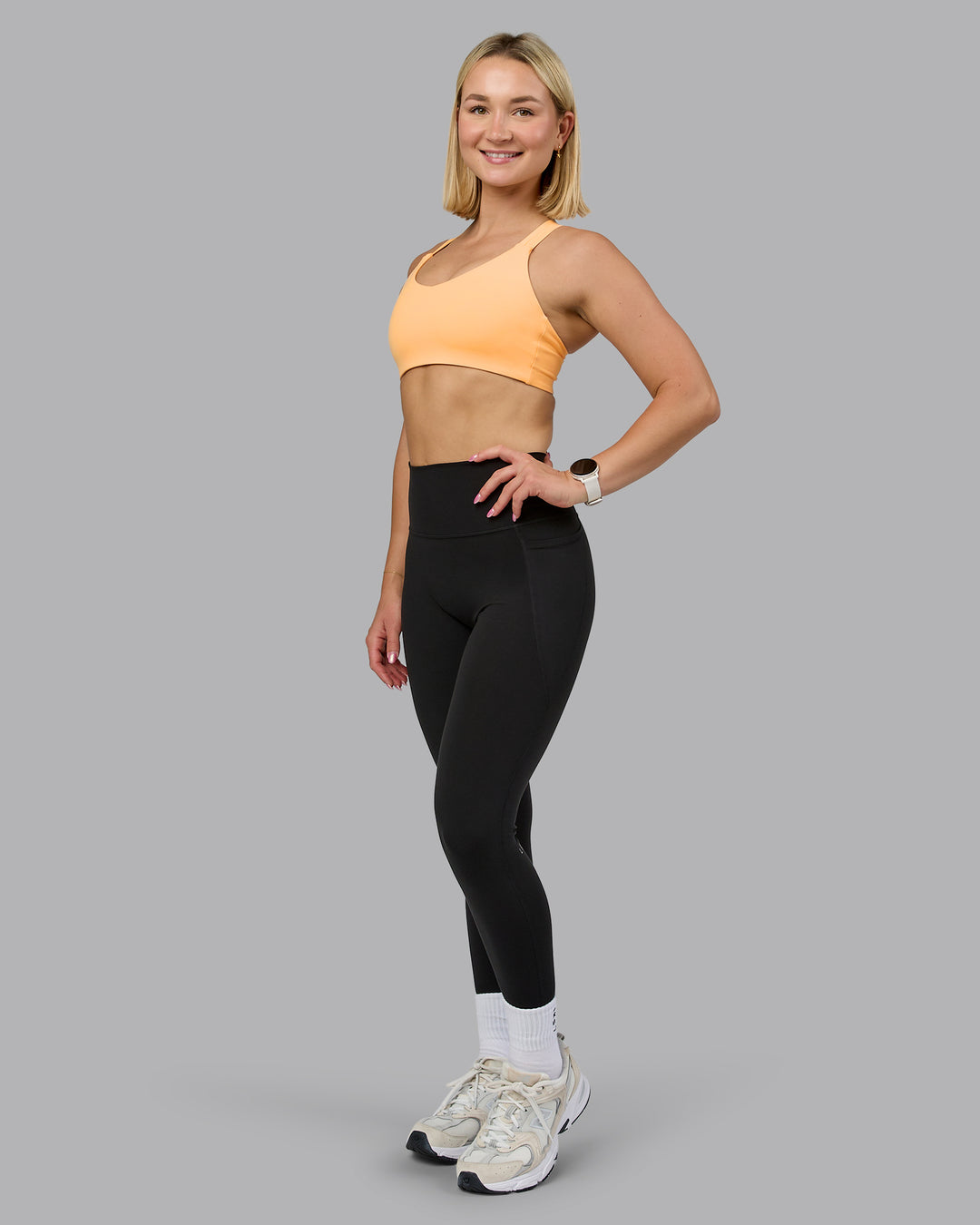 Woman wearing Push The Limit Sports Bra - Peach Fuzz | Model:Halle | Size:S