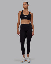 Woman wearing RXD Low-Rise 7/8 Legging - Black | Model:Blaize | Size:S