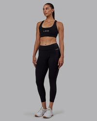 Woman wearing RXD Low-Rise 7/8 Legging - Black | Model:Blaize | Size:S