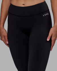 Woman wearing RXD Low-Rise 7/8 Legging - Black | Model:Blaize | Size:S