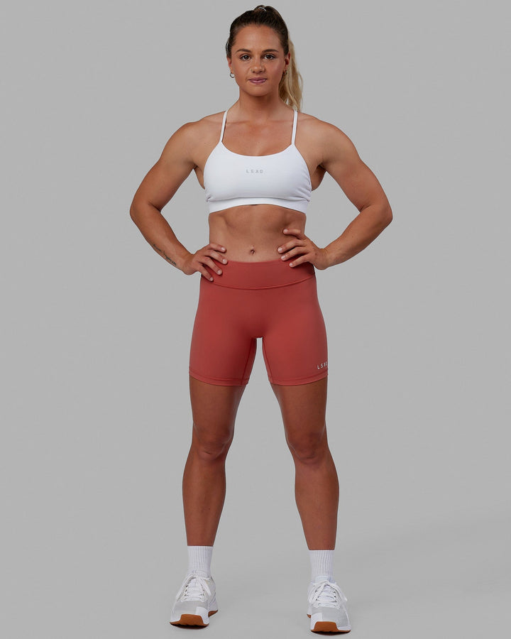 Woman wearing RXD Mid Short Tight - Mineral Red